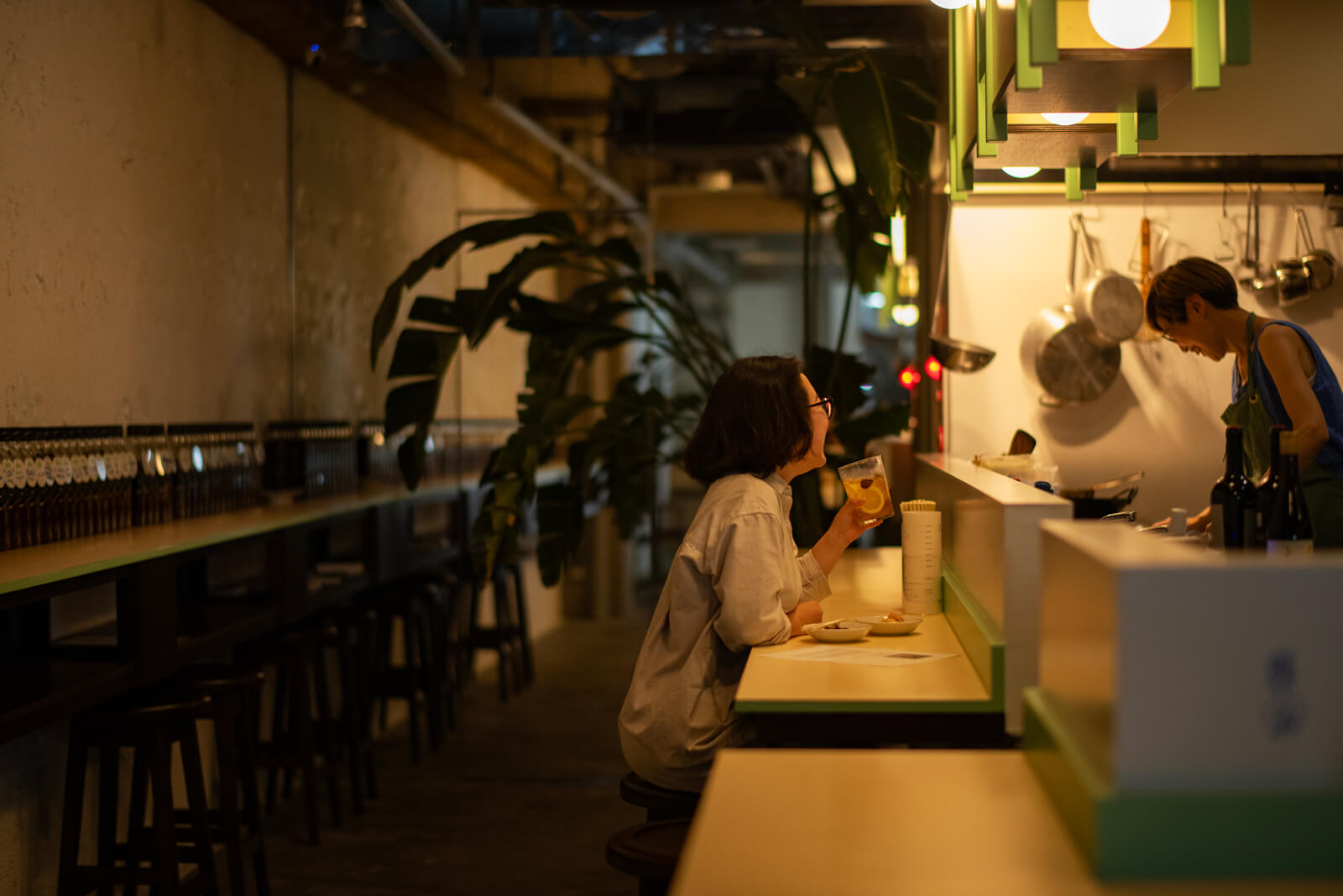 People who enjoy drinking while watching someone cook in the kitchen