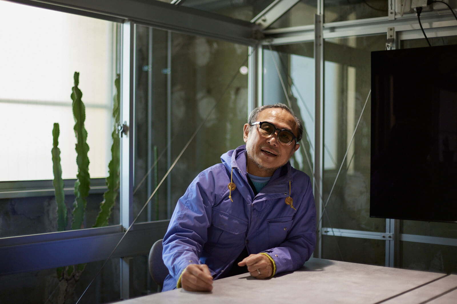 Mr.Toyama answering questions in an interview